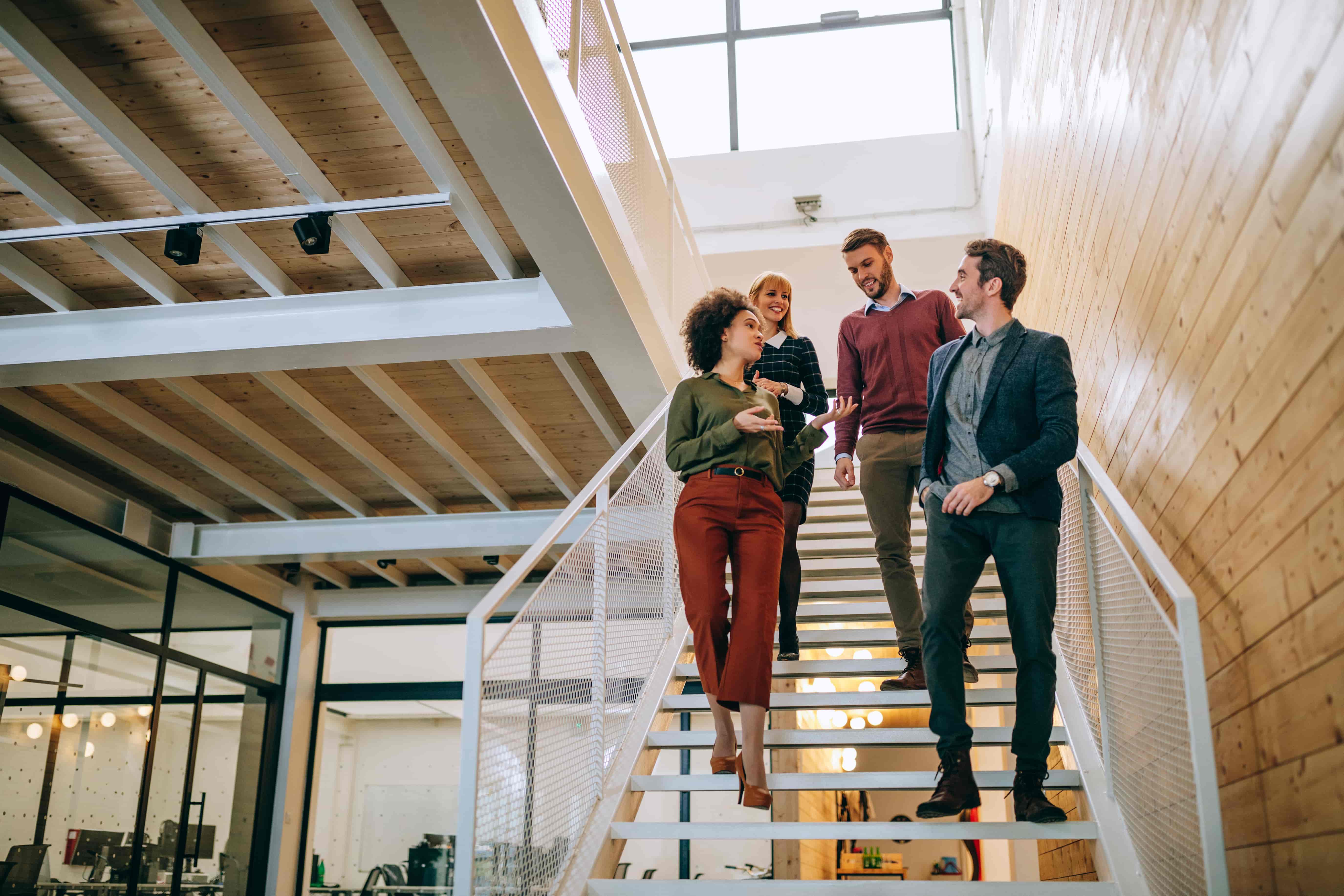 Young employees walking down the stair